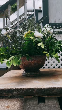 elegant outdoor floral arrangement in bronze vase