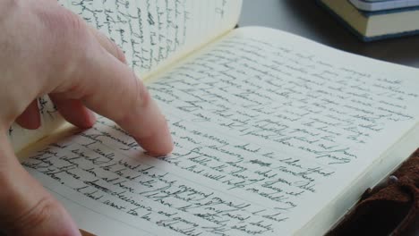 flipping through handwritten notebook or journal to a blank page