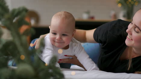 mother and baby on bed