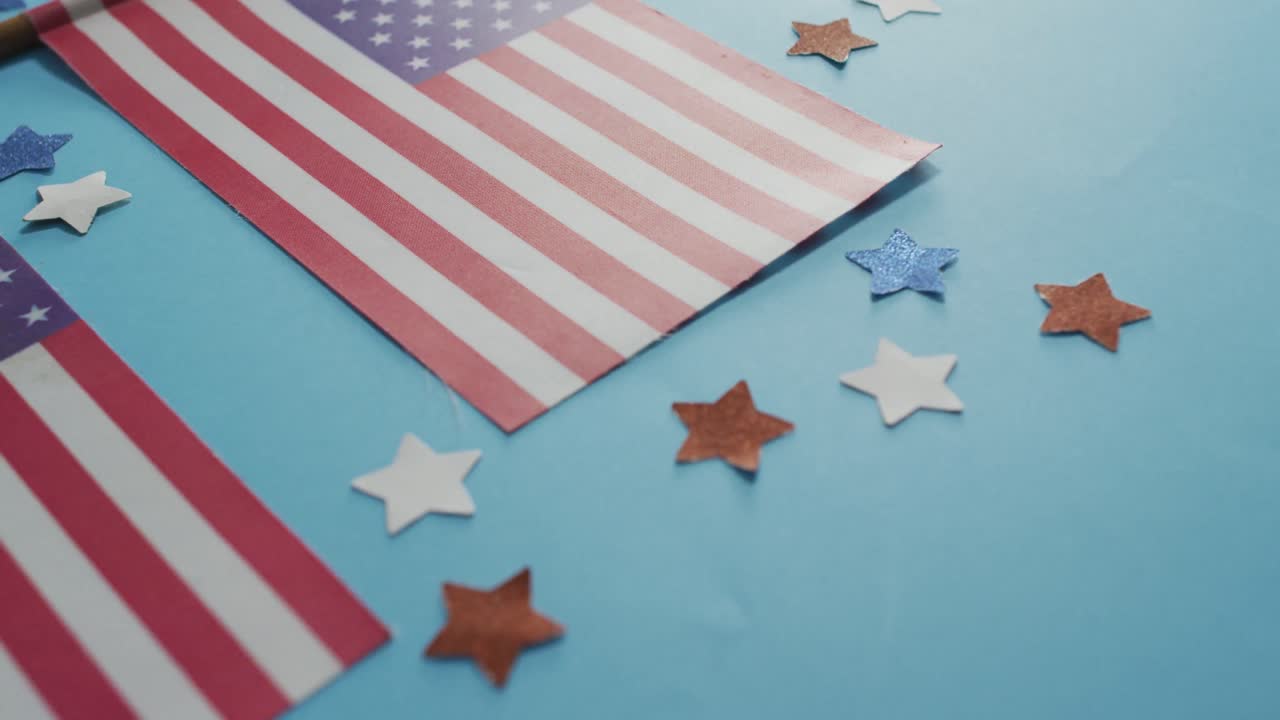 American flags with red and blue stars lying on blue background