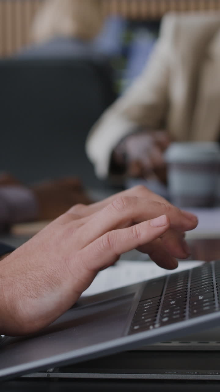 People working on laptops in an office