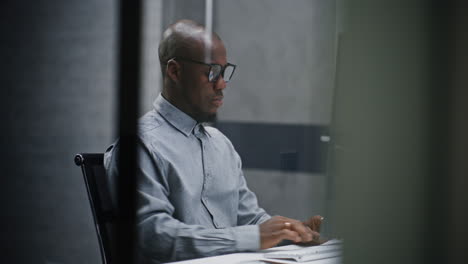 man working on computer in modern office
