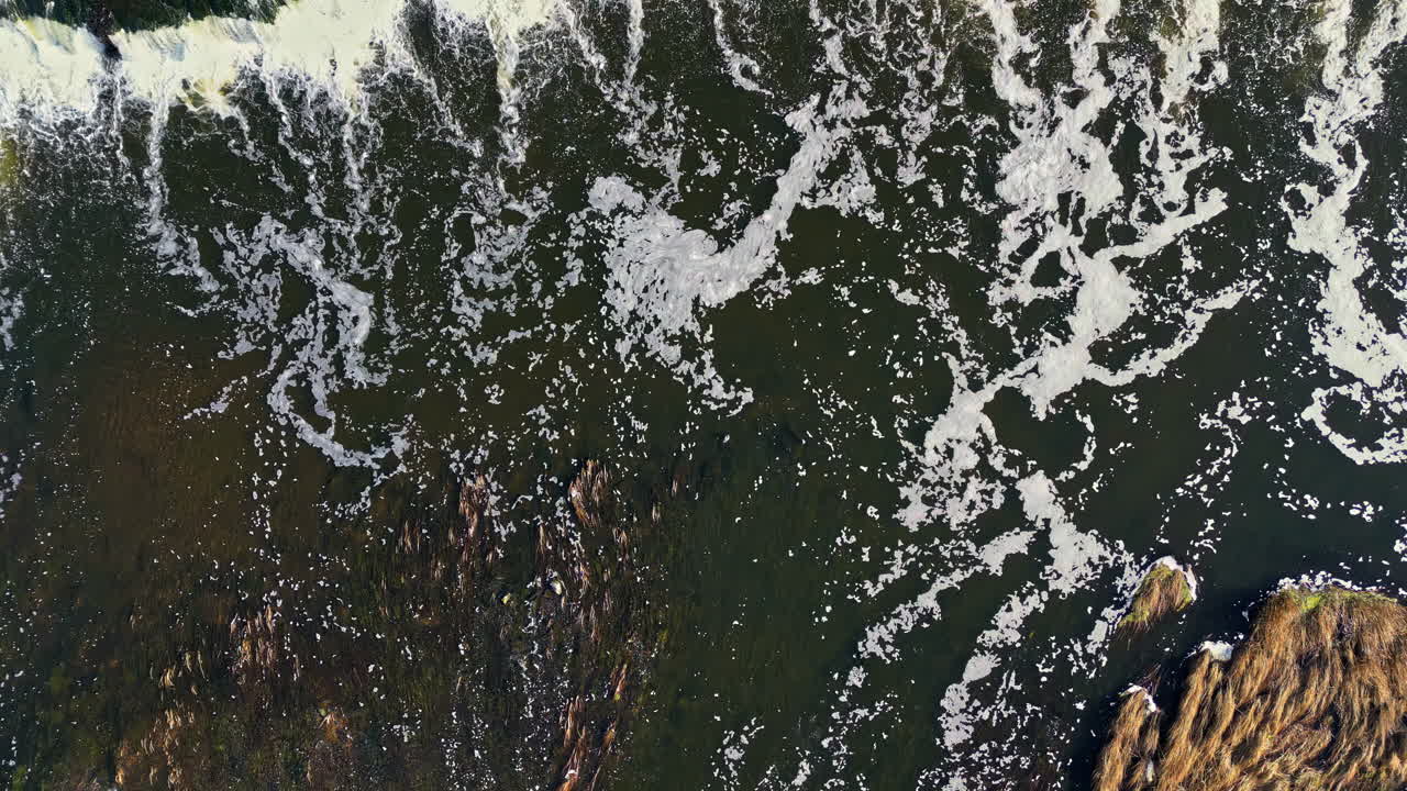 Aerial View of a Waterfall and River