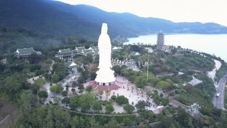 aerial round motion large buddha statue in religious complex