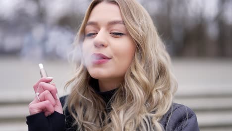 woman applying lipstick outdoors