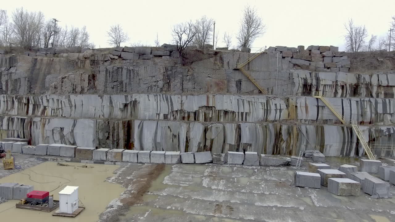 Aerial shot of giant marble blocks lined up in the stone quarry