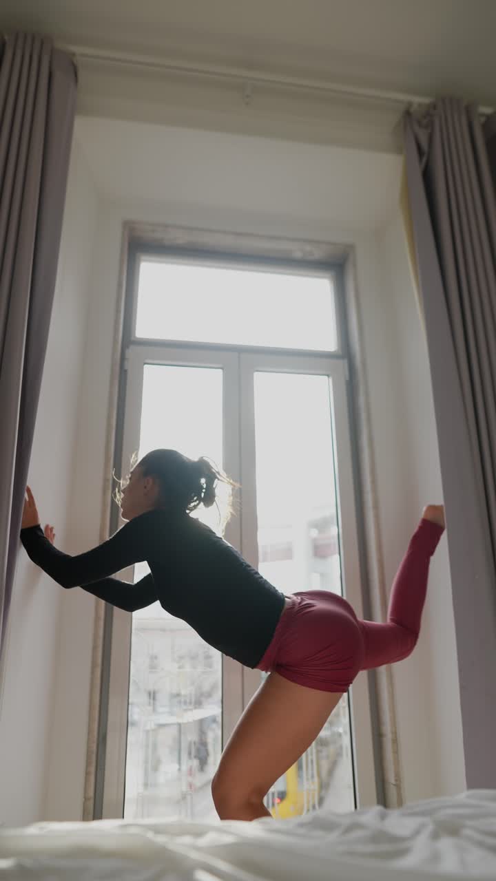 Woman Dancing in a Bedroom with a View
