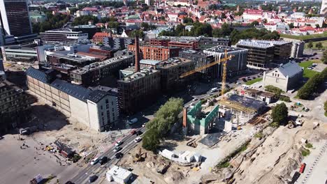 Panoramic-aerial-view-of-Tallinn-modern-cityscape-and-old-town-in-background