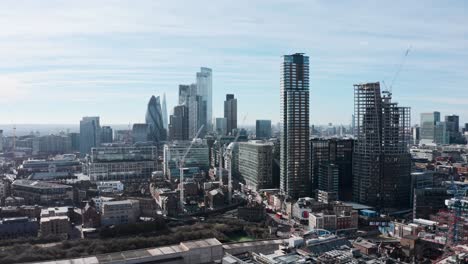 rising drone shot of city of london from shoreditch