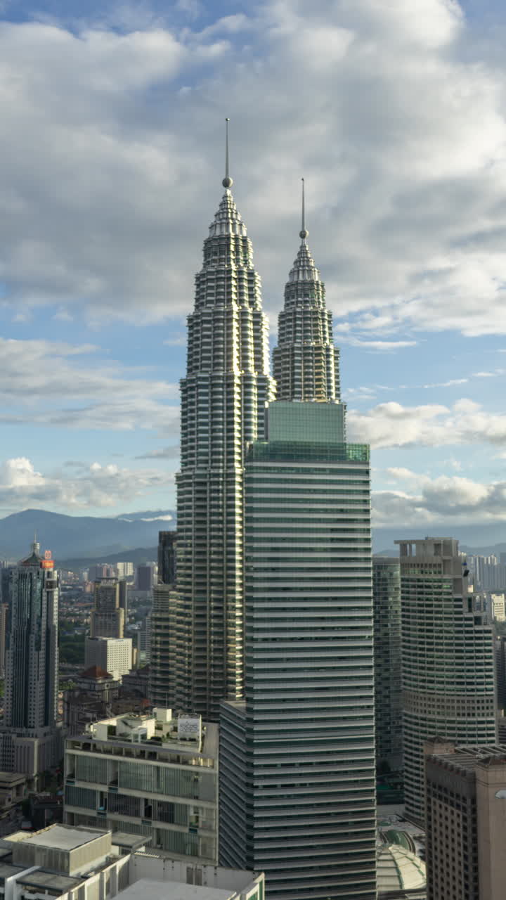 KUALA LUMPUR - 29 MARCH 2025 : Timelapse of the Kuala Lumpur skyline from a high vantage point in vertical