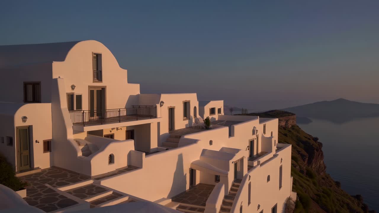 Soft morning light illuminating the tranquil Aegean Sea and islands near Santorini, with a traditional whitewashed building perched on the caldera cliff, creating a serene and picturesque scene