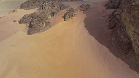 aerial revealed sandstone mountains in wadi rum protected area in southern jordan