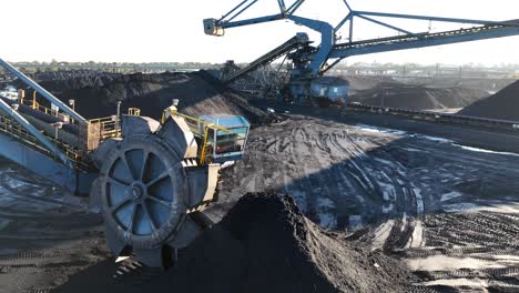 industrial coal mine with conveyor belts and large wheel excavator