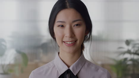 portrait young asian business woman intern smiling friendly enjoying professional career beautiful ethnic female in office slow motion