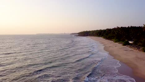 aerial of golden sand beach during sunset near kannur, india