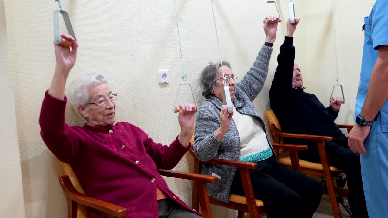 Elderly Patients Doing Arm Exercises with Assistance