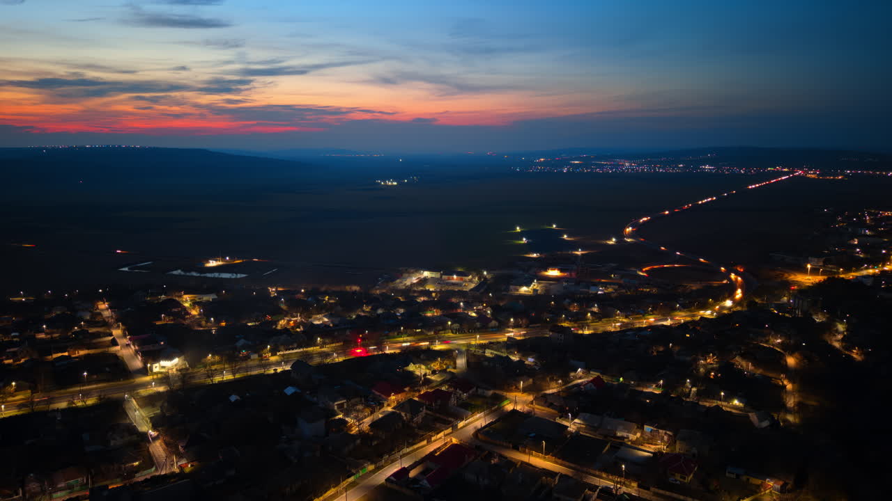 Aerial drone view of cars moving through Chisinau, Moldova at sunset time lapse