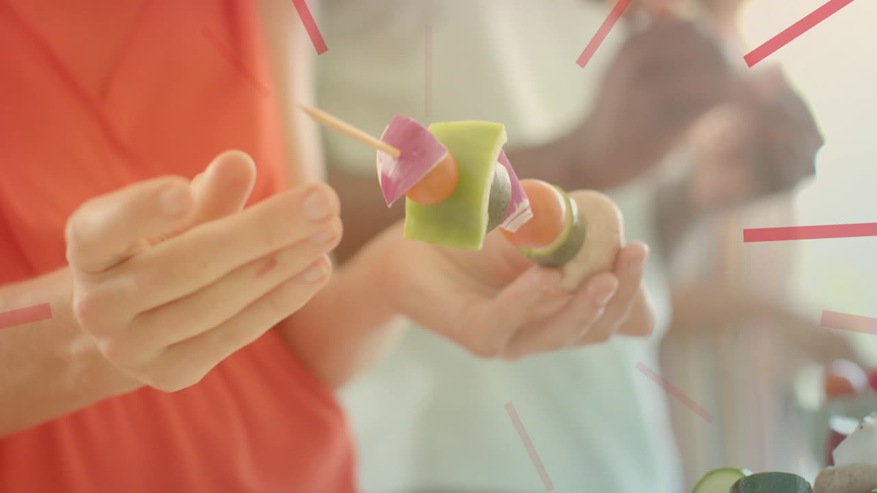 Holding vegetable skewer, person preparing food with clock animation over