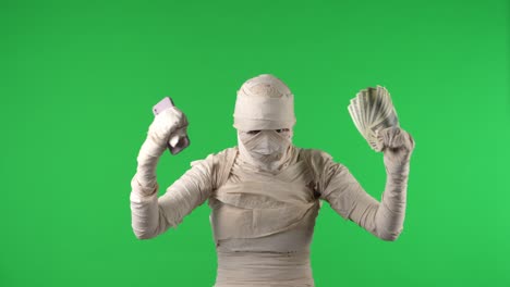 green screen isolated chroma key video capturing a mummy dancing and singing actively into the