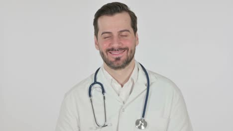 young doctor smiling at camera, white background
