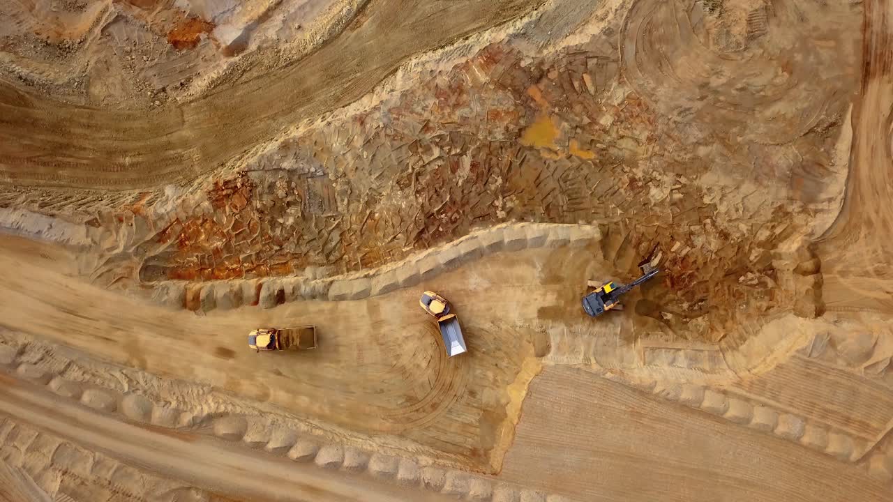 Aerial View of Rock Quarry Excavation Bulldozer and Trucks are Loading Rocks