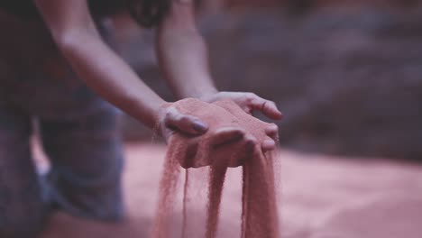 close up hands grabbing sand, arid desert, wadi rum, jordan, static shot