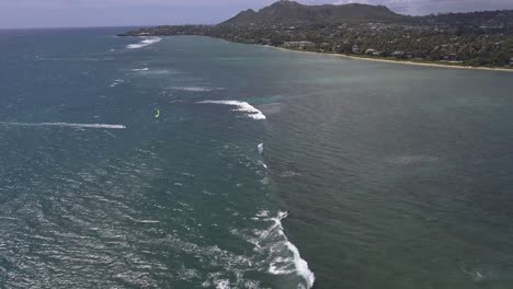 aerial view of kitesurfer sailing along waialae beach in oahu hawaii 2