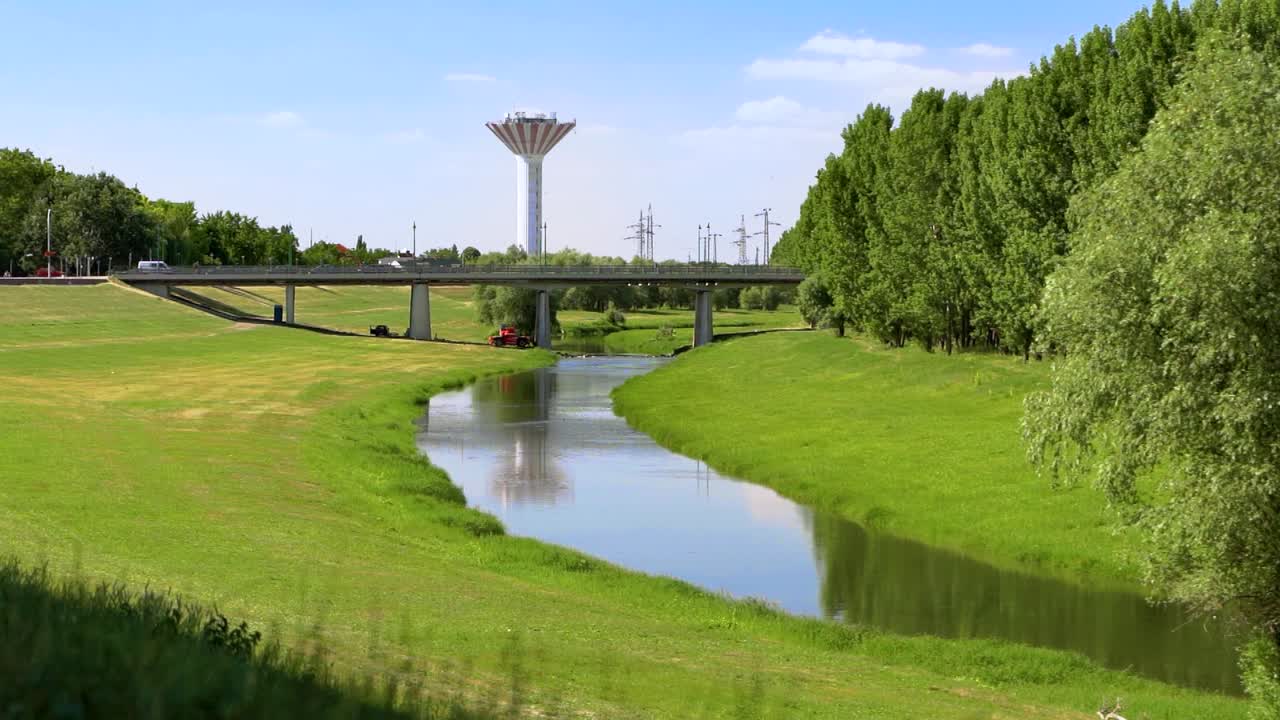 The Zagyva creek in Szolnok, Hungary with a bridge - slow motion, steady