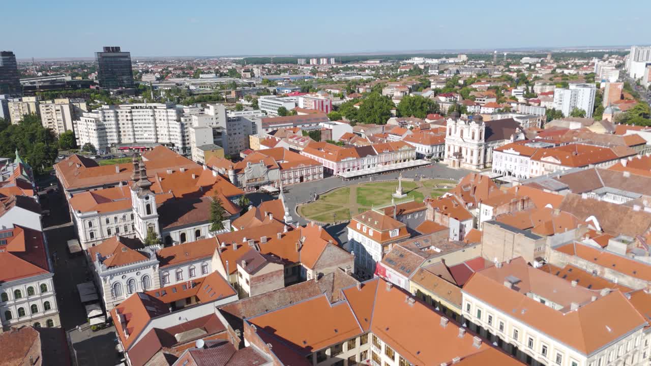 Scenic aerial of the iconic Union Square in Timisoara, framed by historic terracotta rooftops and heritage architecture