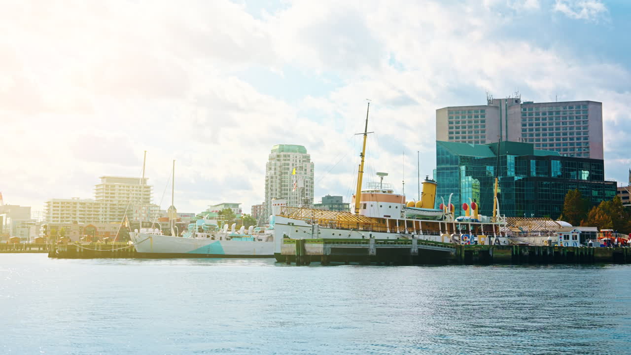 Boat tour exploring Halifax Downtown in Nova Scotia, Canada. Waterfront Skyline of the city. View of the financial district. Sightseeing of Halifax.