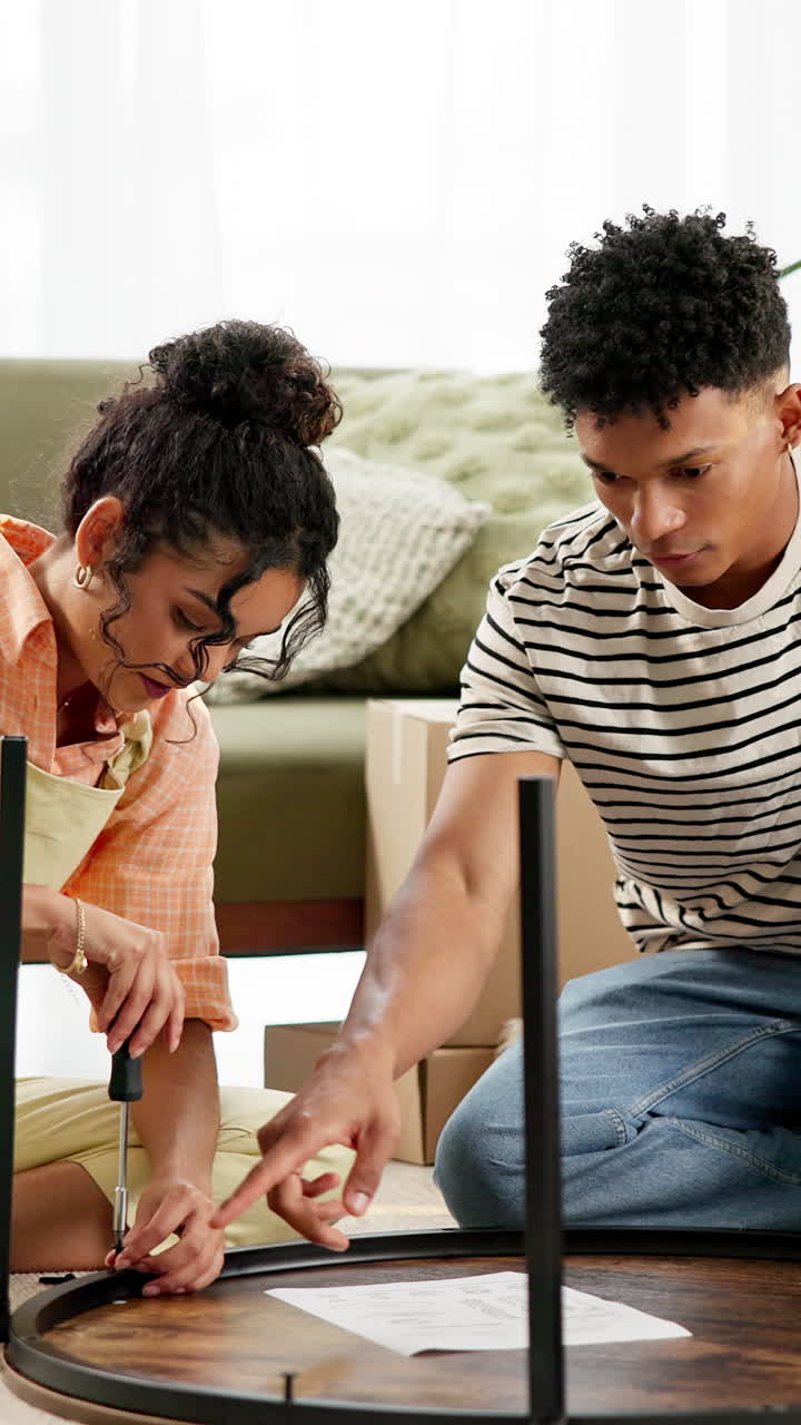 Couple Assembling Furniture Together at Home