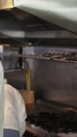 group of chefs cheering and putting their hands together