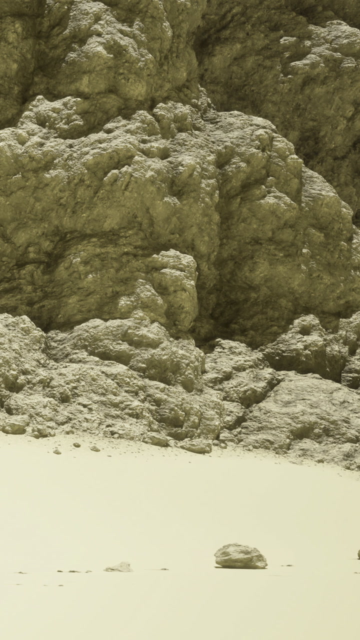 Rocks and sandy ground in the desert under bright sunlight during midday