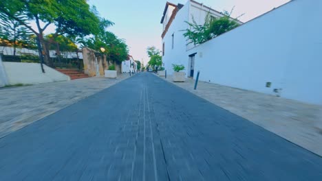 Aerial-forward-flight-through-old-street-in-COLONIAL-ZONE-of-Dominican-Republic