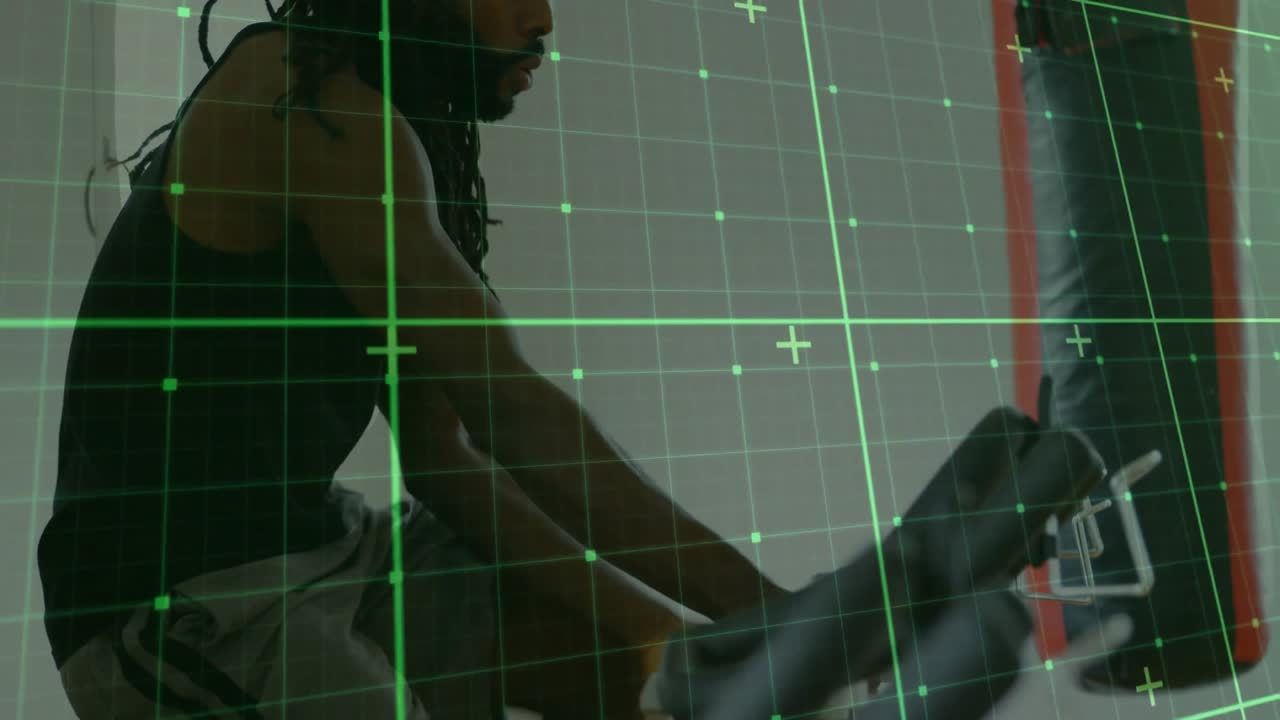 Male athlete pedaling bike under digital grid overlay, showing muscle motion for fitness tracking