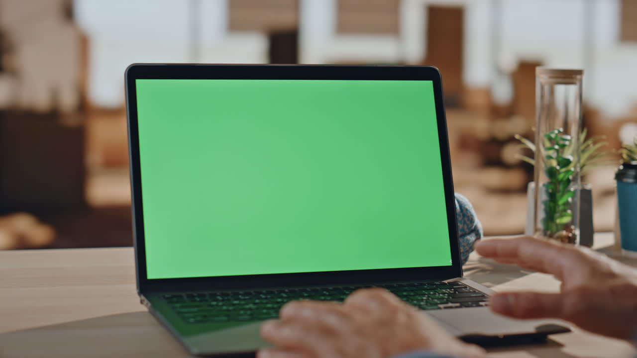 Closeup businessman having videocall at greenscreen computer in work desk office