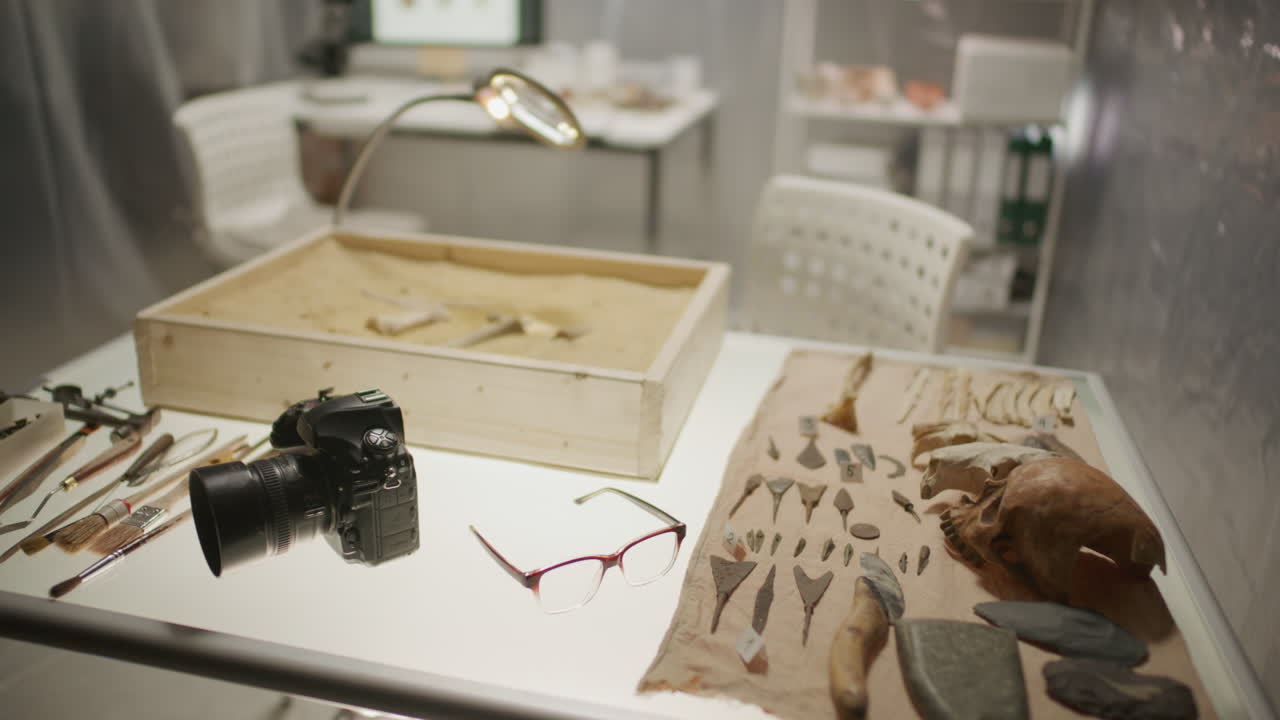 Research Table with Sand-Filled Box, Tools and Artifacts in Archaeology Lab