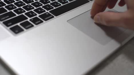 Working-with-Laptop.-Closeup-Side-View-Shoot-of-Female-Hands-Typing-on-The-Laptop-Keyboard.