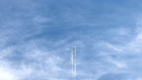 jets perform synchronized maneuvers, leaving trails against a clear sky. captured at avalon airshow, showcasing precision and skill