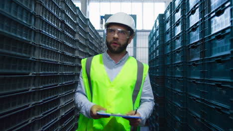 storage worker counting boxes preparing shipment package inspecting delivery