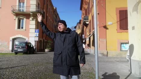 man waiting in a european city