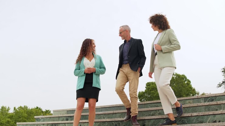 Business People Walking Down Stairs