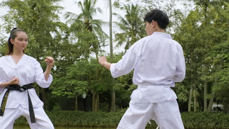 young couple fighting in class outdoors