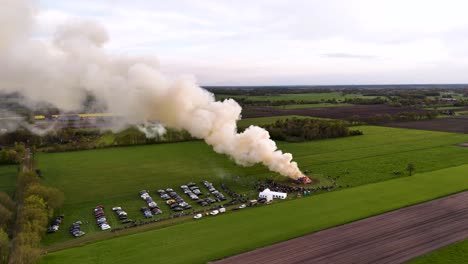 aerial view of a large outdoor event with burning