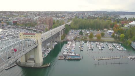 gorgeous 4k drone revealing bridge with traffic as camera moves up