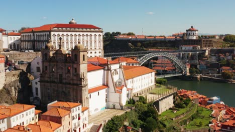 close-up aerial drone shot of the luis i bridge, the douro river and the city of porto, in portugal