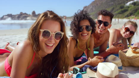 friends relaxing on the beach