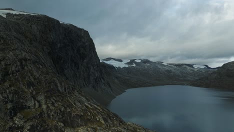 Aerial-over-the-rugged-and-moody-landscape-near-Djupvattnet,-Geiranger,-Norway