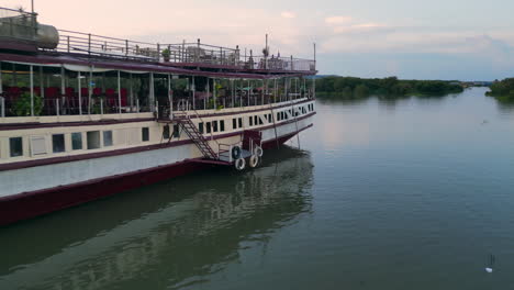 old river boat sits idle among the mangroves in cambodia