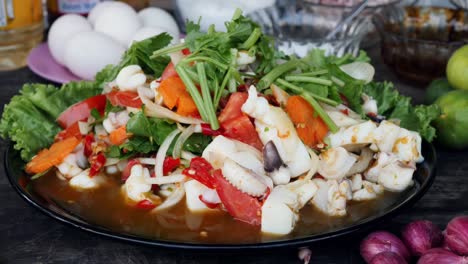 Close-up-of-delicious-Thai-squid-and-vegetable-dish-on-table